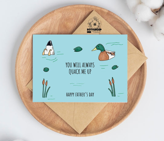 Quack Me Up greeting card on a wooden plate with kraft envelope