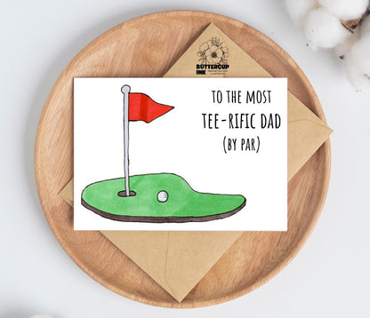 Tee-rific Dad greeting card on a wooden plate with kraft envelope